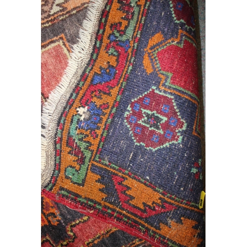 649 - A Kazak design mat with single gul on a red ground, 38