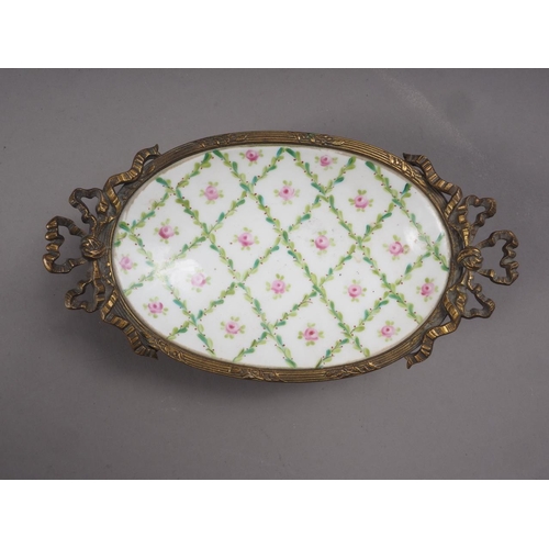 68 - A Continental shaped dish with floral decoration, 10