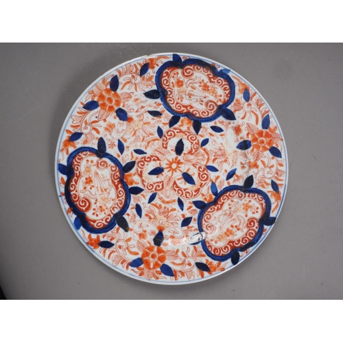 87 - An 18th century Chinese export plate, a similar plate and other Oriental ceramics (chips and repairs... 