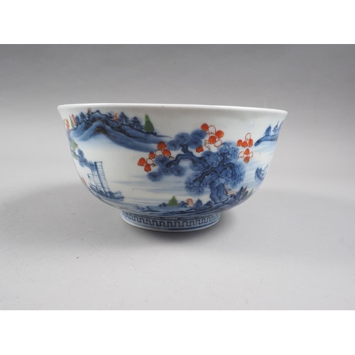 89 - Two Chinese blue and white bowls with later clobbered decoration, larger 8 1/2