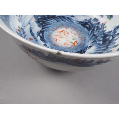 89 - Two Chinese blue and white bowls with later clobbered decoration, larger 8 1/2