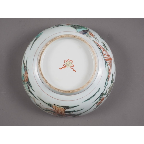 95 - A Chinese famille vert dish with Kylins in a landscape decoration, 11