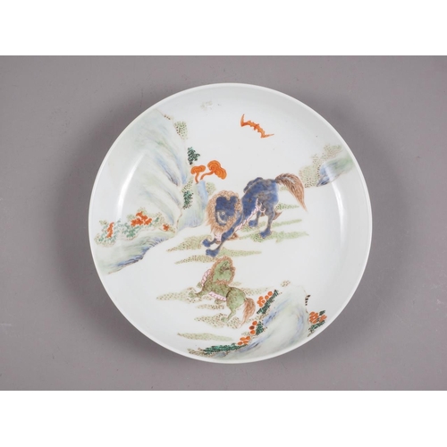 95 - A Chinese famille vert dish with Kylins in a landscape decoration, 11