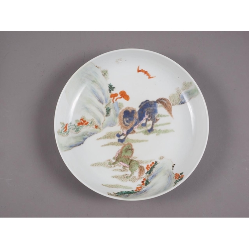 95 - A Chinese famille vert dish with Kylins in a landscape decoration, 11