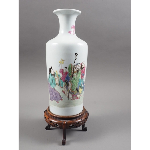 97 - A Chinese famille rose tapered vase with figures in a landscape decoration, 10 1/4