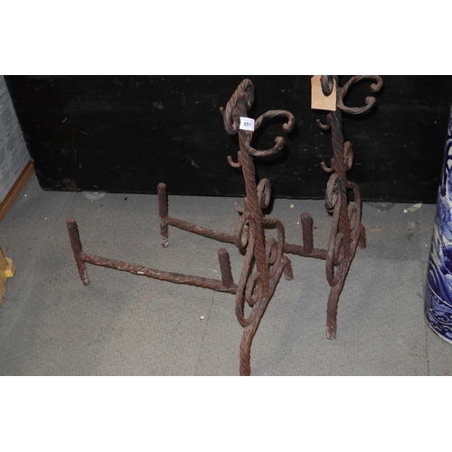 651 - A pair of wrought iron fire dogs, 25