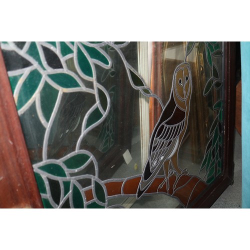 652 - A window, fitted stained glass panel with owl design, 34 1/2