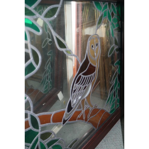 652 - A window, fitted stained glass panel with owl design, 34 1/2