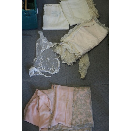 228 - An assortment of clothing, including a satin dress, gloves and other items