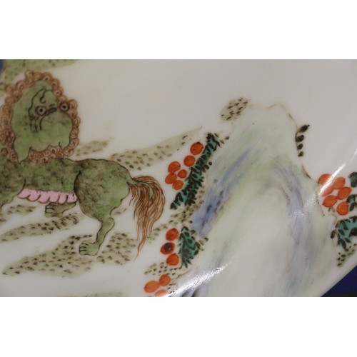 95 - A Chinese famille vert dish with Kylins in a landscape decoration, 11