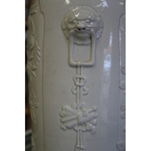 100 - A Chinese blanc de chine vase with relief panels decorated with birds, trees and animals, 13