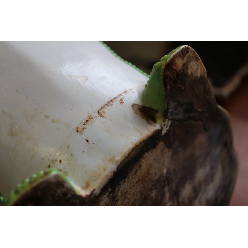 93 - A Chinese plant pot, formed as a frog, on hardwood stand, 10