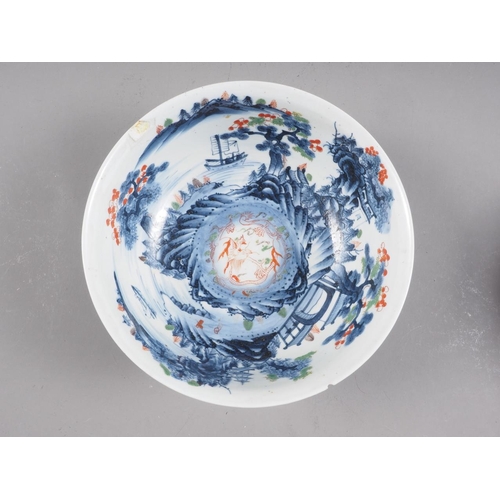 90 - Two Chinese blue and white bowls with later clobbered decoration, larger 8 1/2