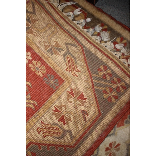 652 - A Kazak runner of traditional design, with seven star  medallions in shades of rust, tan, grey and n... 