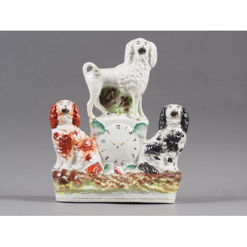 19 - A 19th century Staffordshire watch group with poodle and spaniels, 9