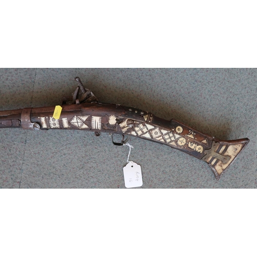 198 - A flintlock jezail with bone inlaid stock, 61