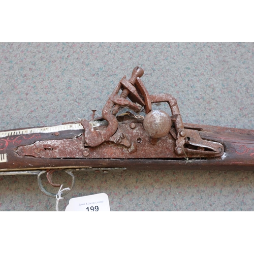 199 - A flintlock jezail with bone inlaid stock and butt (heavily rusted)