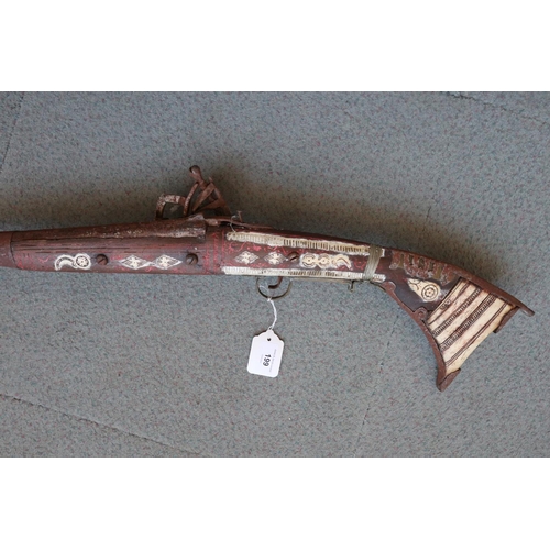 199 - A flintlock jezail with bone inlaid stock and butt (heavily rusted)