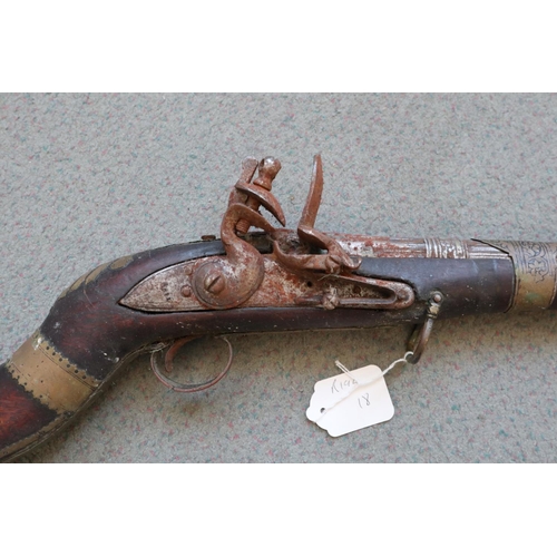 200 - A flintlock jezail with horn and hardwood stock, and flared fluted barrel, 16