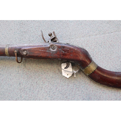 203 - A flintlock jezail with Tower Armouries flintlock action, bone and horn butt and octagonal barrel, 4... 