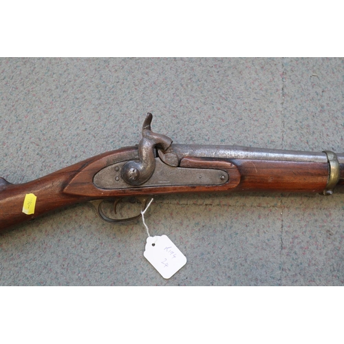 205 - A percussion cap musket with hardwood stock patched in copper, 42 3/4