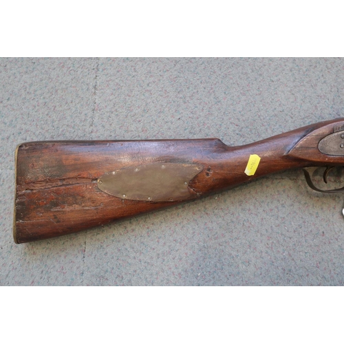 205 - A percussion cap musket with hardwood stock patched in copper, 42 3/4