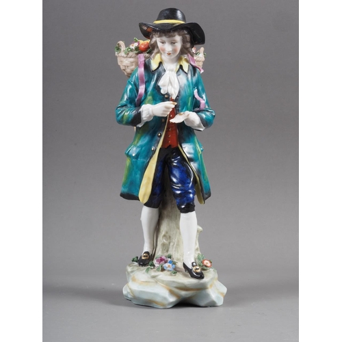 21 - A Sitzendorf porcelain figure of a flower seller, 9 3/4