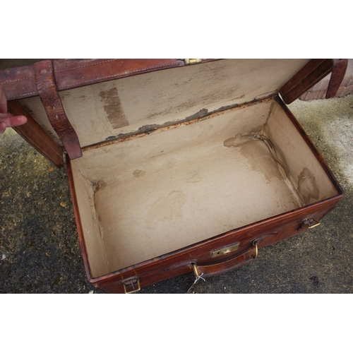 231 - A 1930s leather travel trunk, 28