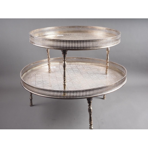 268 - Two silver plated and engraved gallery edge trays, on turned supports, 23