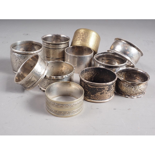 280 - Seven silver napkin rings, various, 5.1oz troy approx, and four other napkin rings