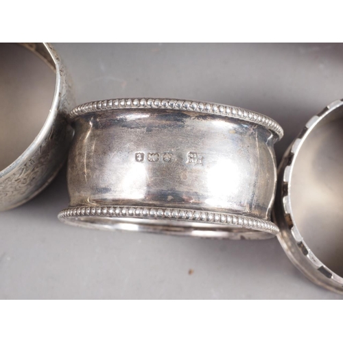 280 - Seven silver napkin rings, various, 5.1oz troy approx, and four other napkin rings