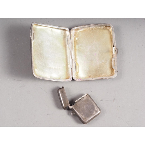 290 - A silver vesta case and a silver cigarette case, 2.3oz troy approx