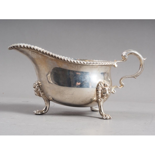 296 - A Payne & Son silver gravy boat, on paw supports, 12.9oz troy approx