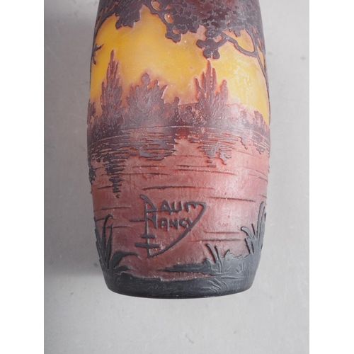 30 - A Daum Nancy overlaid and etched yellow ground cylinder vase with landscape decoration, 4 3/4