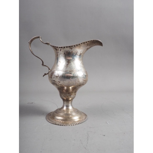 304 - A Georgian silver cream jug, on circular foot, 2.6oz troy approx