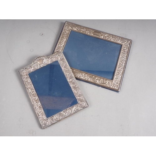 305 - A rectangular silver photograph frame with embossed decoration, 7