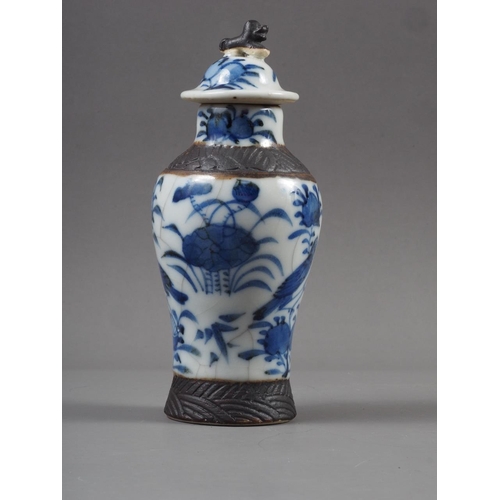 89 - A Chinese Canton bulbous vase and cover, decorated panels with figures in a landscape, insects and f... 