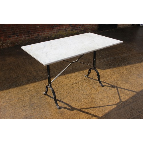 653 - A rectangular framed marble top loggia table, on cast iron splay support, and four metal framed chai... 