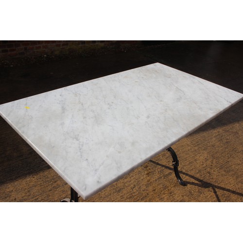 653 - A rectangular framed marble top loggia table, on cast iron splay support, and four metal framed chai... 