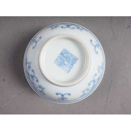 101 - A Chinese blue and white bowl with flower and scrolled decoration, and seal mark to base, 4