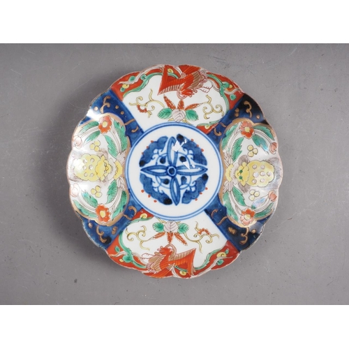 102 - A Chinese shaped Imari plate with mythical beast decoration, 8 1/4