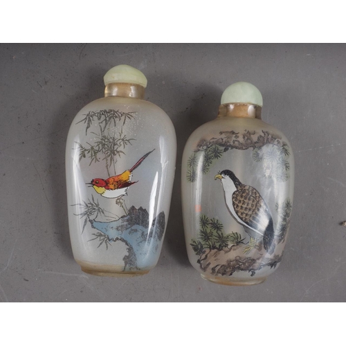 120 - Two Chinese interior painted snuff bottles and stoppers, tallest 3 1/4