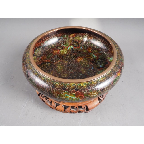 121 - A Chinese cloisonne bowl with floral and leaf decoration, 8 1/4