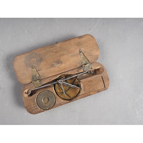 128 - An 18th century brass and steel balance, in fruitwood case, monogrammed WL, case 4 1/2