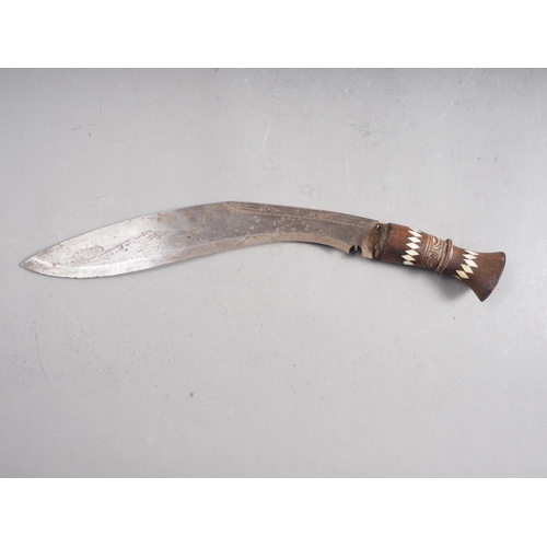 182 - A South East Asian Kris dagger with brass scabbard, a Kukri with bone inlaid handle and a machete wi... 