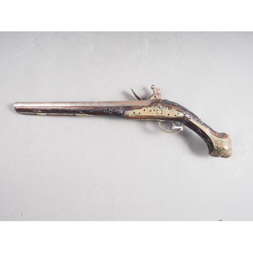 190 - A Continental flintlock long barrel pistol with carved and inlaid stock, 19