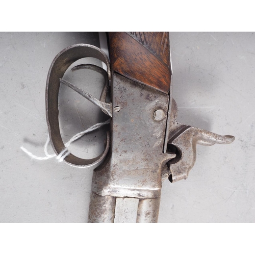 192 - A largely 19th century over and under double-barrelled percussion cap pistol with walnut stock, 12