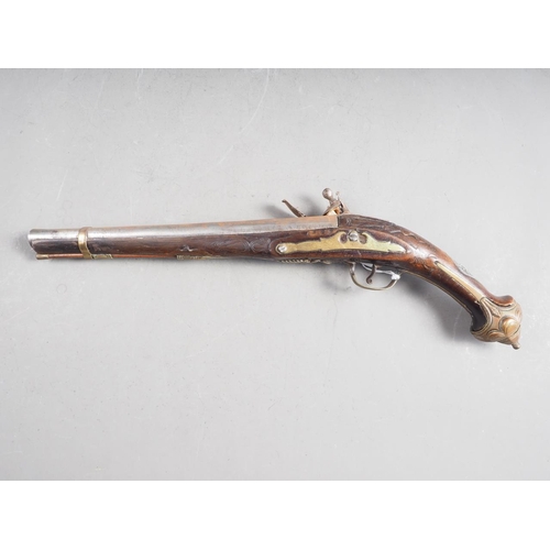 196 - A Continental flintlock pistol with carved and inlaid walnut stock, 19