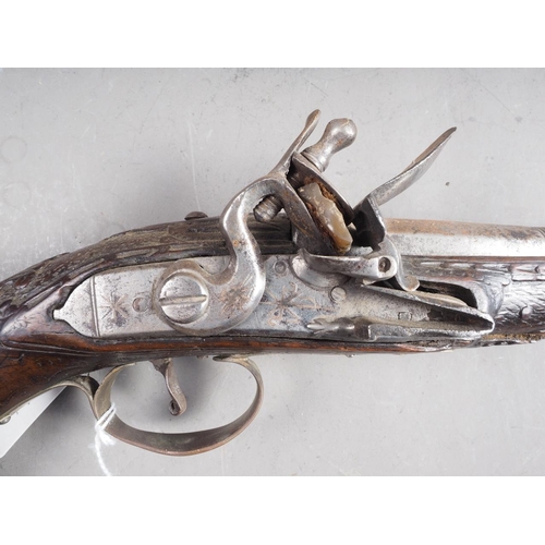 197 - A 19th century walnut stock, brass and white metal mounted flintlock pistol, 17