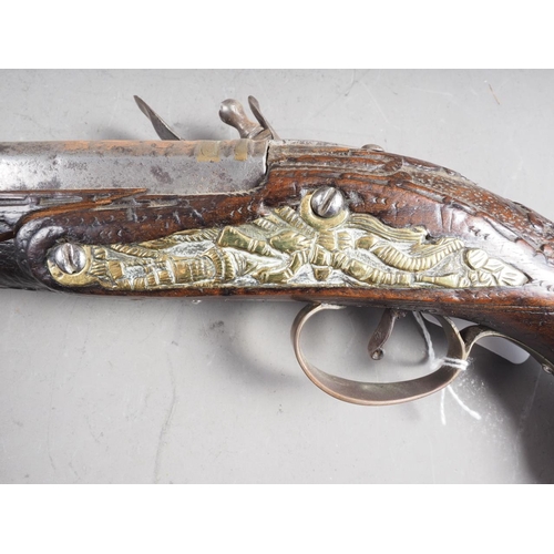 197 - A 19th century walnut stock, brass and white metal mounted flintlock pistol, 17